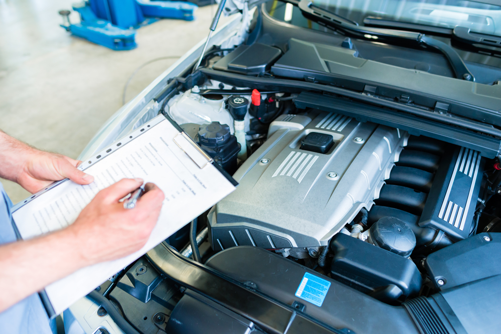 Person performing a state inspection on a maryland car