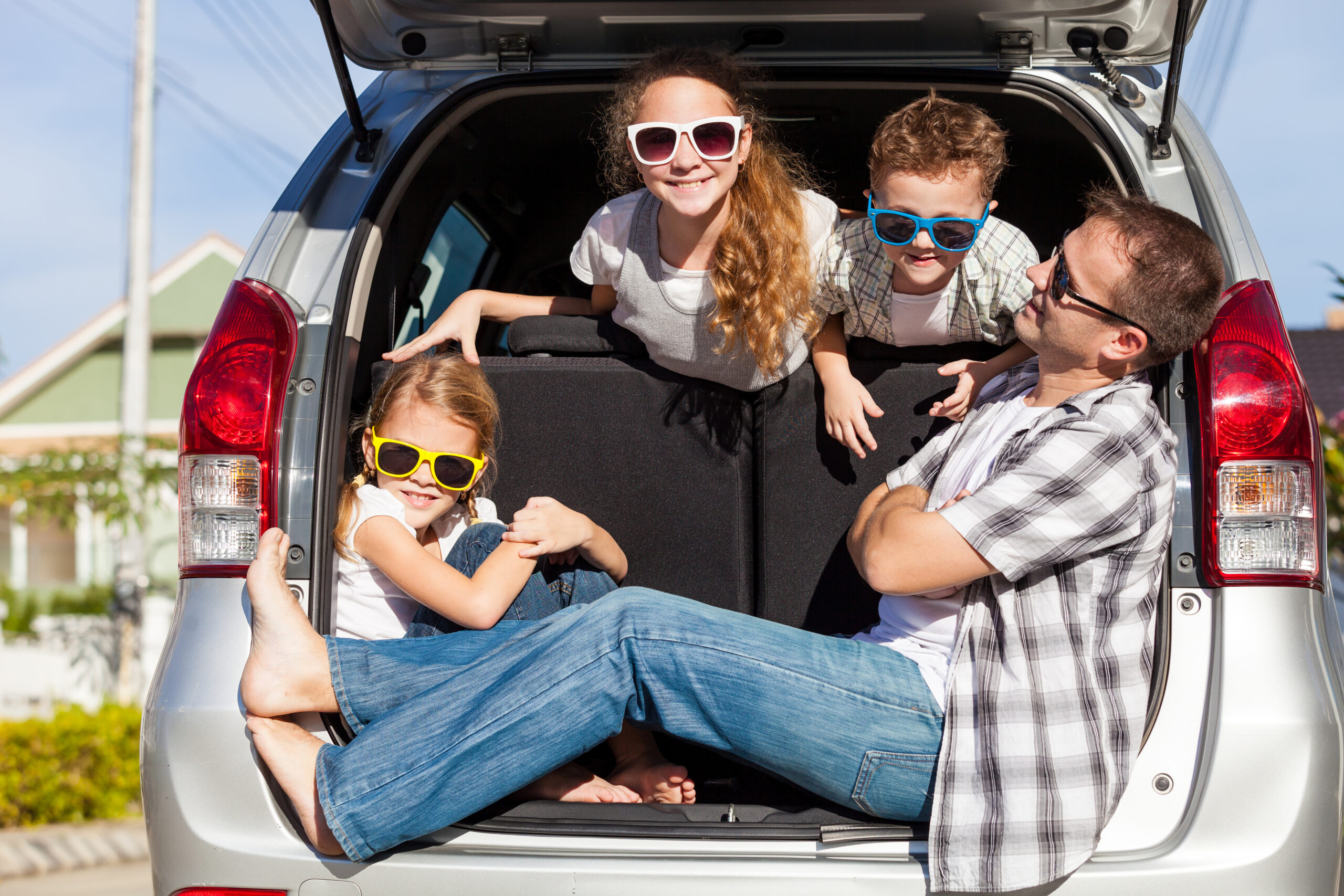 Family who just got their car road ready for summer